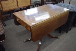 Late Georgian mahogany pedestal pembroke table raised on a turned column with four outswept legs