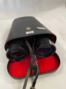 A large pair of binoculars in original case