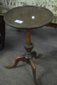 Reproduction mahogany wine table raised on tapering column with tripod base, top 27cm diameter