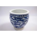 19th Century Chinese porcelain jardiniere, the blue ground decorated with dragons chasing the