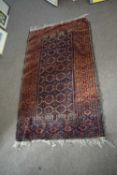 Small 20th Century Middle Eastern wool floor rug decorated with a central geometric panel in a