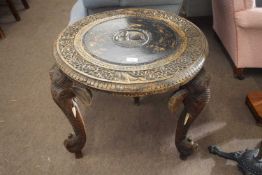 20th Century Indian hardwood circular occasional table decorated with carved floral detail and
