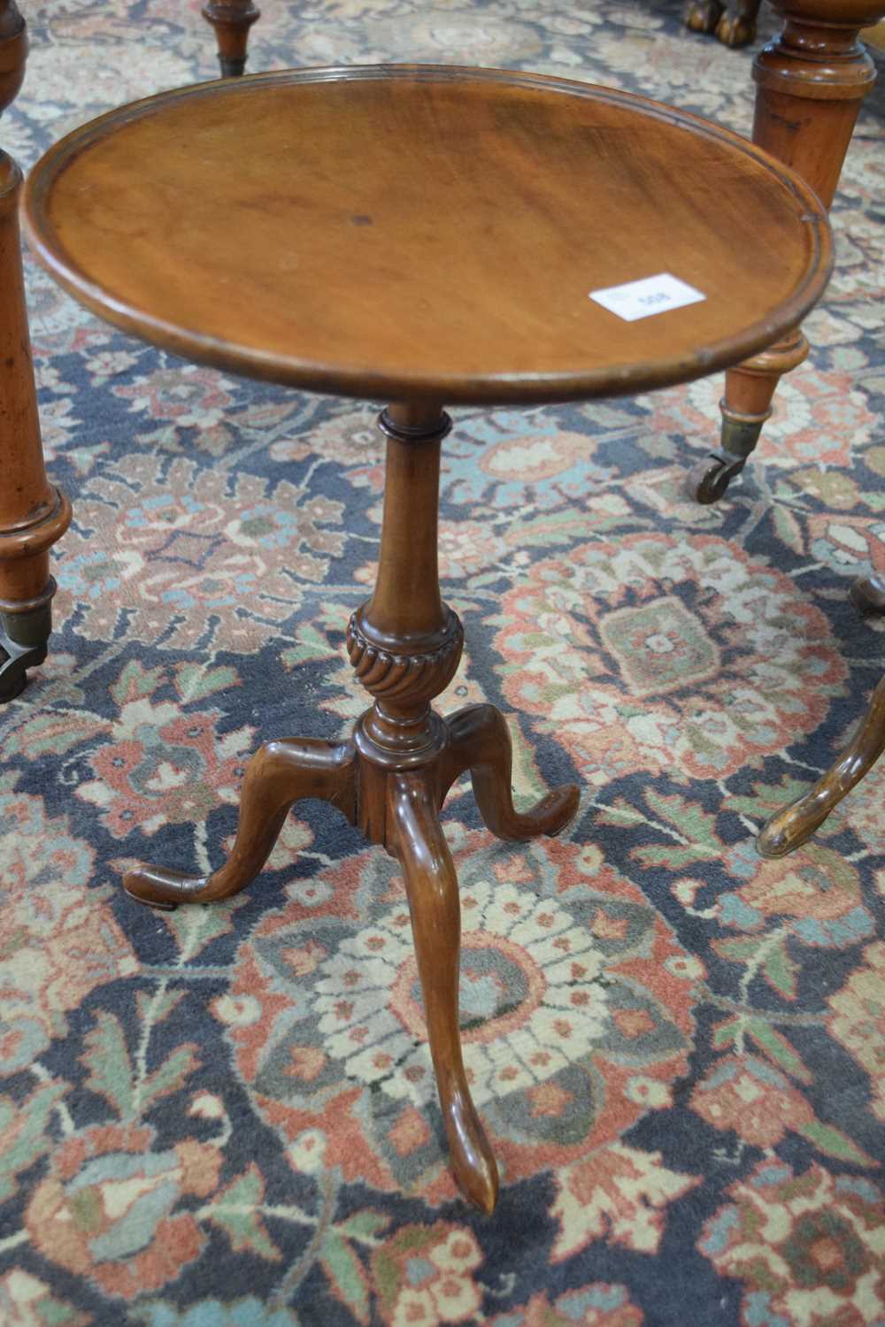 Reproduction mahogany wine table with circular tray top over a tapering column with urn detail and a