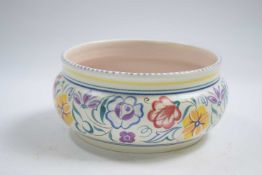 Poole pottery bowl with typical floral designs, 17cm diameter