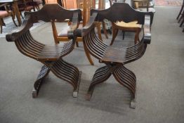 Pair of 20th Century Savonarola chairs with flower carved decoration to the arms, 95cm high