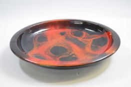 Royal Doulton flambe dish signed by Noke with a mottled sung glaze, 32cm diameter
