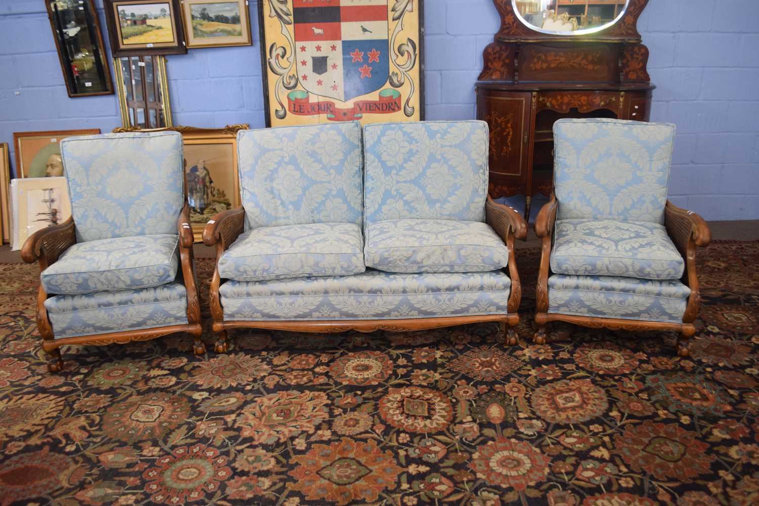 Late 19th or early 20th Century Bergere three piece suite comprising of two seater sofa and a pair