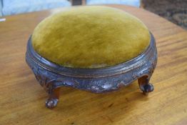 Small Victorian circular foot stool with upholstered top and carved four footed frame, 33cm wide