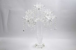 Glass chandelier centrepiece with four candle holders and brass droplets, 48cm high