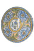 Continental delft charger decorated with a floral design, 42cm diameter