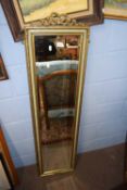 20th Century narrow rectangular bevelled wall mirror in gilt finish frame, 130 x 135 cm