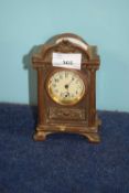 Early 20th Century metal mantel clock made in USA, the white enamel dial with black numerals with