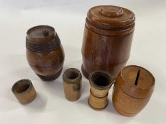A mixed lot - oilve wood mini barrel, dice shaker, Mauchline ware money box marked Crystal Palace,