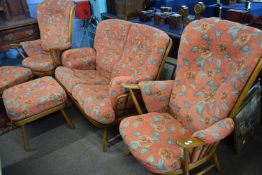 Ercol stick back three piece suite together with accompanying pair of stools, largest piece 140cm