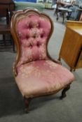Victorian mahogany framed floral upholstered nursing chair raised on short cabriole legs, 92 cm