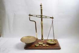 Set of Avery scales with weights, the scales marked W Avery, Birmingham mounted on a rectangular