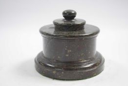 Marble inkwell and cover raised on circular base