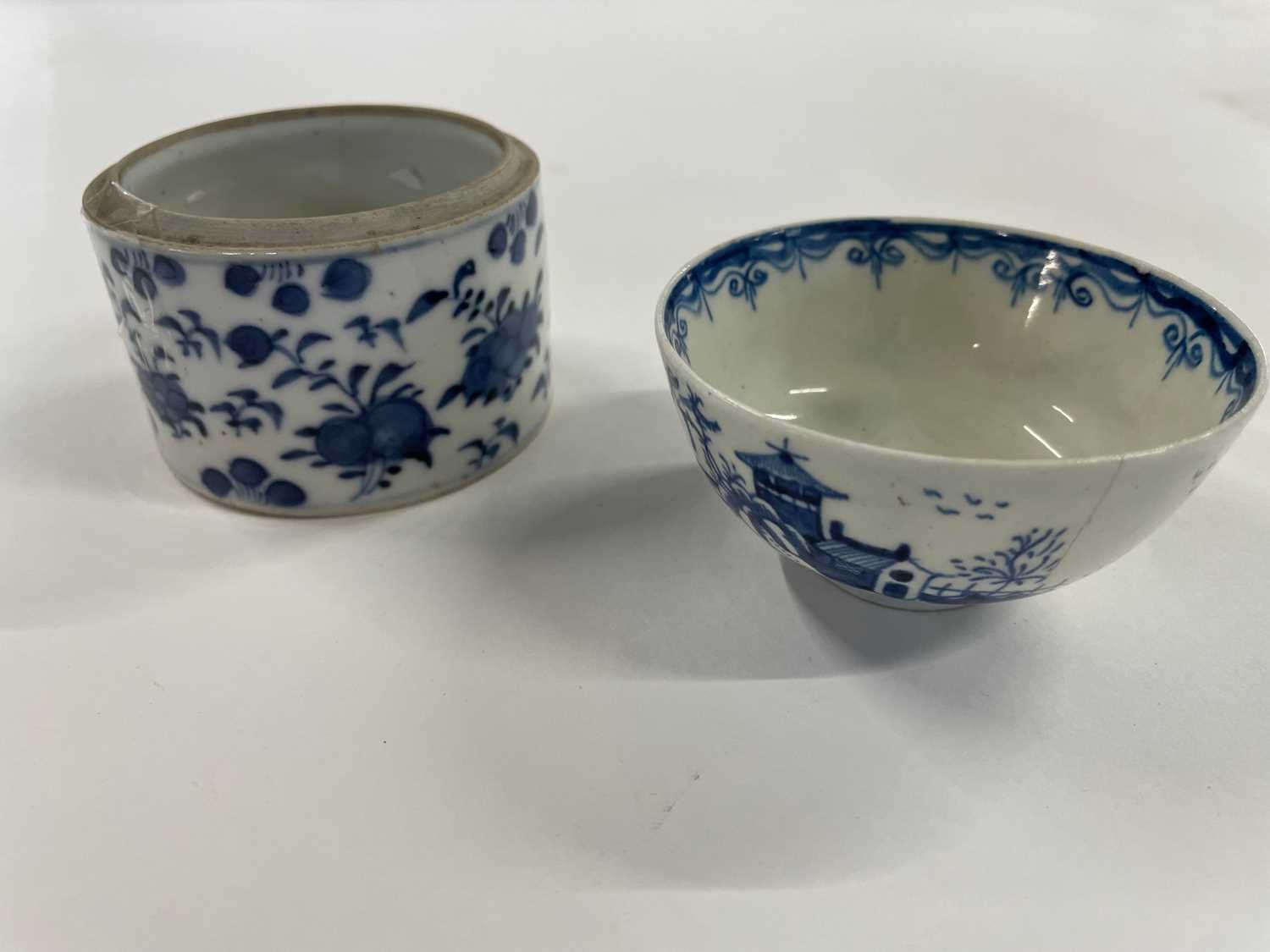 Lowestoft tea bowl painted in blue with chinoiserie design together with a further small jar with