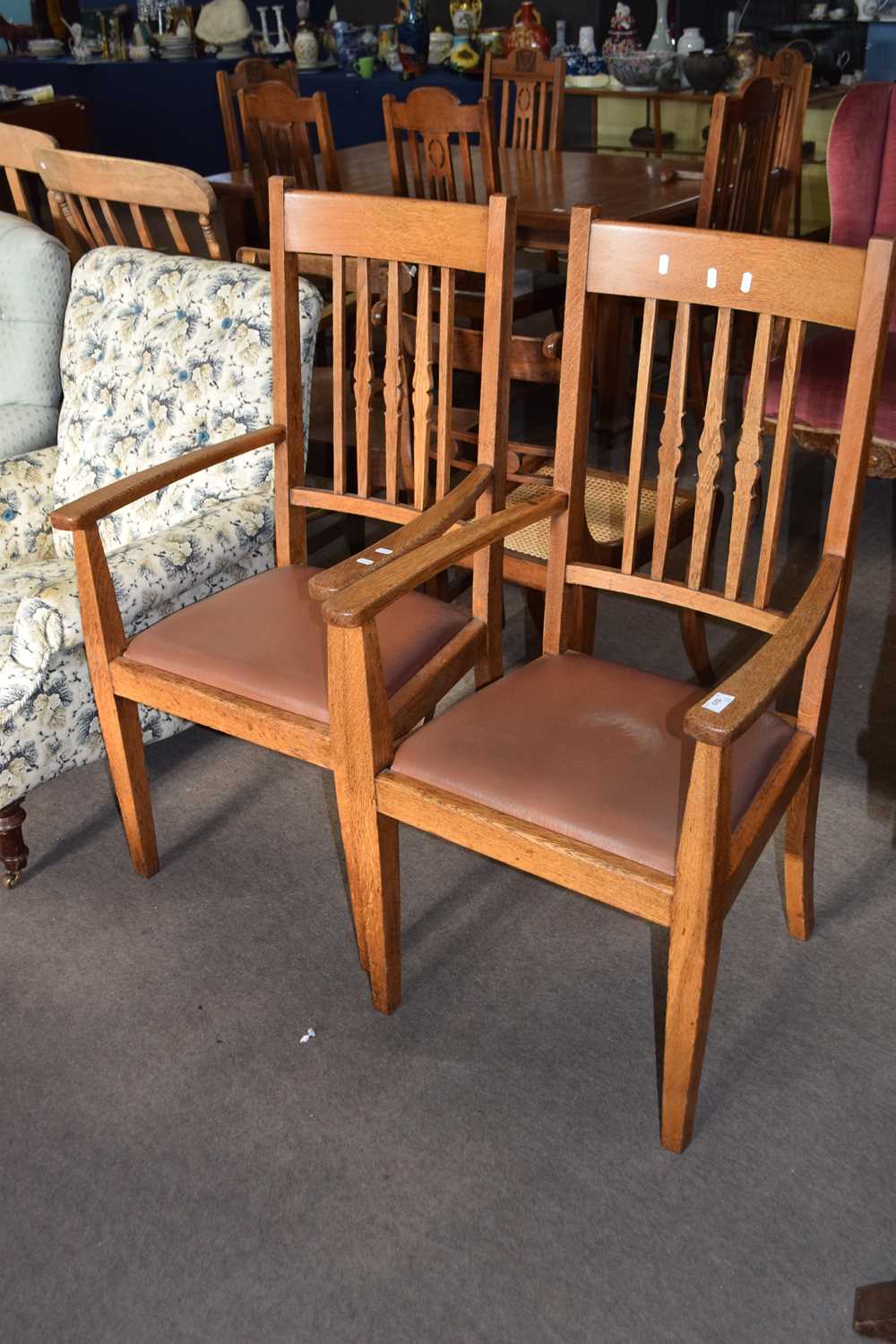 Pair of 20th Century light oak carver chairs with drop in seats