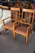 Pair of 20th Century light oak carver chairs with drop in seats