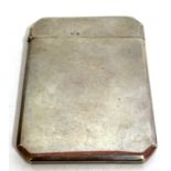 A George V silver card case of plain polished form having cantered corners and hallmarked Birmingham