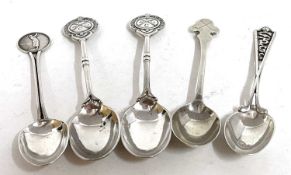 A group of teaspoons to include two plated Walker & Hall golf related spoons, silver teaspoon with a