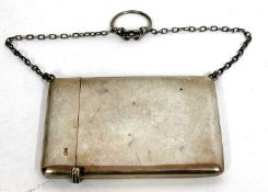 A George V card case of plain polished rectangular form with chain and ring handle, Chester 1911,