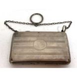 A George V card case with banded engine turned decoration with chain and ring handle, Chester