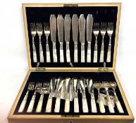 A cased set of mother of pearl handle fish servers to include twelve forks, twelve knives and one
