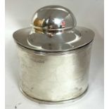 A Edward VII silver tea caddy and spoon of plain form with reeded edges, the domed hinged lid