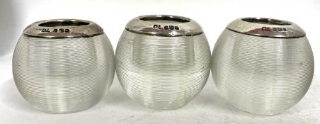 Three George VI silver and glass match strikers, each rim hallmarked for London 1921, makers mark