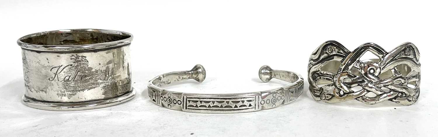 Mixed Lot: A white metal torque bracelet, stamped 925 together two hallmarked silver serviette