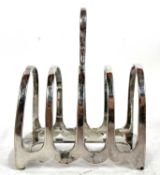 A George V silver toast rack, four divisions and loop carrying handle, Sheffield 1914, makers mark