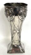 An Art Nouveau German (800) tall vase, the four corners decorated with flowers, leaves and stems,