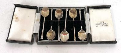 A cased set of six seal top coffee spoons, Birmingham 1956, makers mark for Turner & Simpson