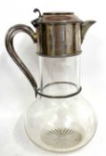 A Victorian glass and silver claret jug, the plain glass bulbous body with engraved base, the silver