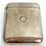 An Edward VII silver card case of plain polished form with spring opening mechanism, London 1903,