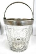 A vintage cut glass ice bucket of pail form with silver rim and handle together with a hallmarked