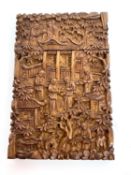 A Chinese Canton carved hardwood card case decorated all over with figural and foliate design