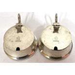 A pair of Edward VII silver mustards of circular squat form, the hinged lids engraved with lion