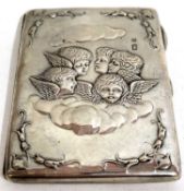 A late Victorian card case, the front embossed with five angels heads, fitted interior, Birmingham