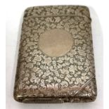 A Victorian cheroot/vesta case having overall engraved foliate decoration around a circular vacant