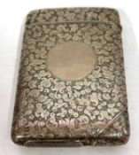 A Victorian cheroot/vesta case having overall engraved foliate decoration around a circular vacant