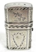A Georgian silver etui case, chased and engraved with flowers and shield cartouches, push button