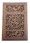A finely carved Indian stained sandlewood card case decorated all over with birds, animals,