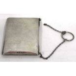 A George V card case of plain rectangular form with chain handle (part detached), leather