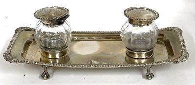 An early 20th Century silver double ink stand of rectangular form with gadrooned edge, marked at the