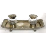 An early 20th Century silver double ink stand of rectangular form with gadrooned edge, marked at the