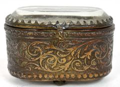 An antique gilt metal trinket box of oval form with hinged glazed lid, 6 x 4 x 3cm