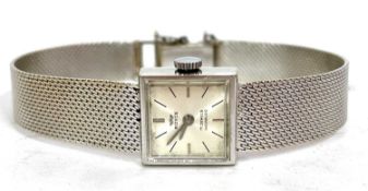 A Ladies Royce precious metal wrist watch stamped 18k on the case back, on a mesh work bracelet, the